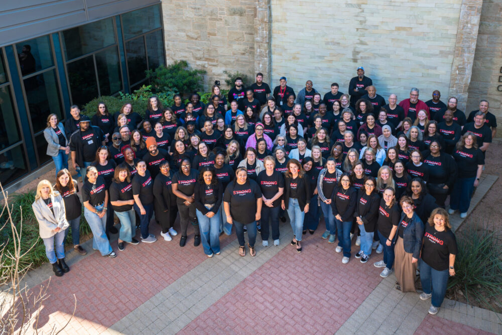 Large group of people wearing matching shirts